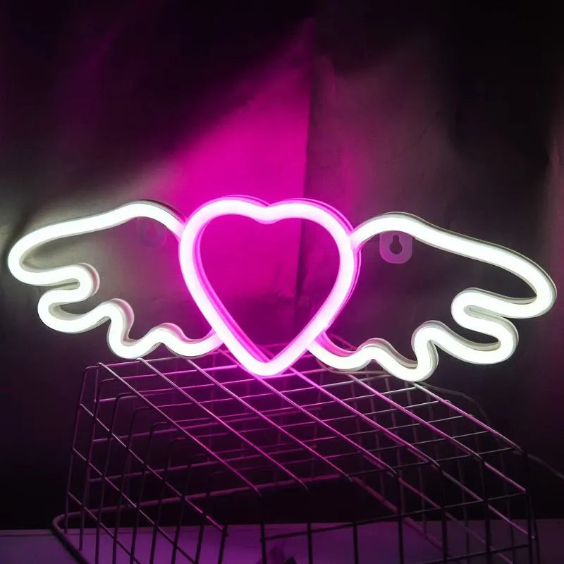 Néon coeur aux ailes d'ange rose et blanc allumer
