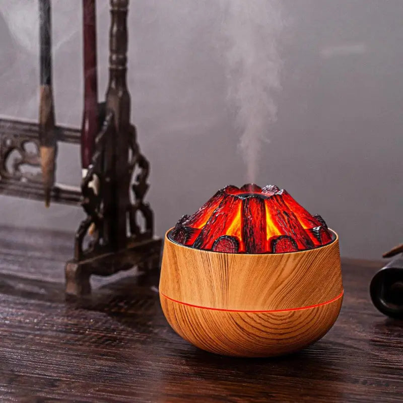 Diffuseur d’effet flamme de cheminée avec brume d’huiles essentielles sur table de nuit