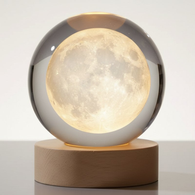 lampe lune cristal lumineuse veilleuse 3D posée sur table de nuit