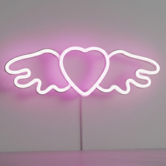Néon LED Ailes d'Ange avec cœur rose allumé sur mur blanc