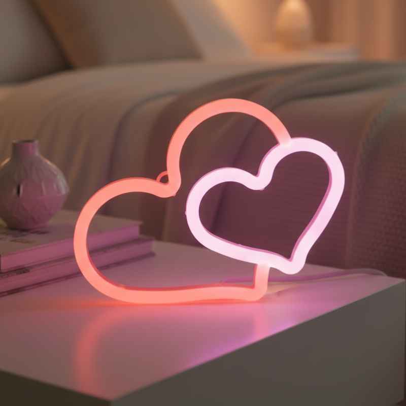 Néon à Led Forme Double Cœur rose suspendu au mur créant une lumière douce et chaleureuse.