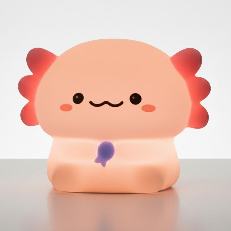 veilleuse axolotl bébé rechargeable en silicone posée sur table de nuit