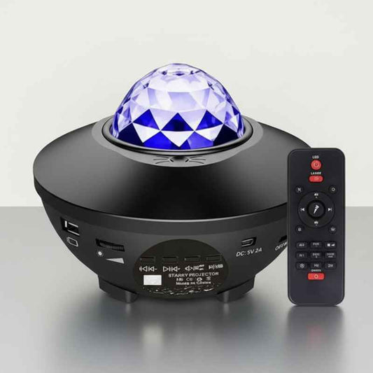 Veilleuse projection plafond LED ciel étoilé bleue posée sur table de nuit