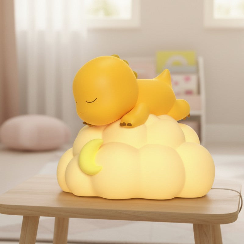veilleuse dinosaure LED posée sur lit de bébé nocturne